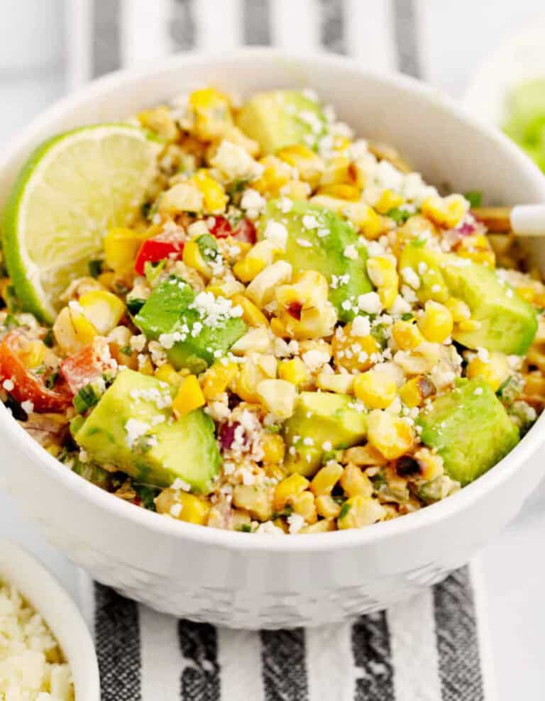 Mexican Street Corn Salad in White Bowl on Striped Towel