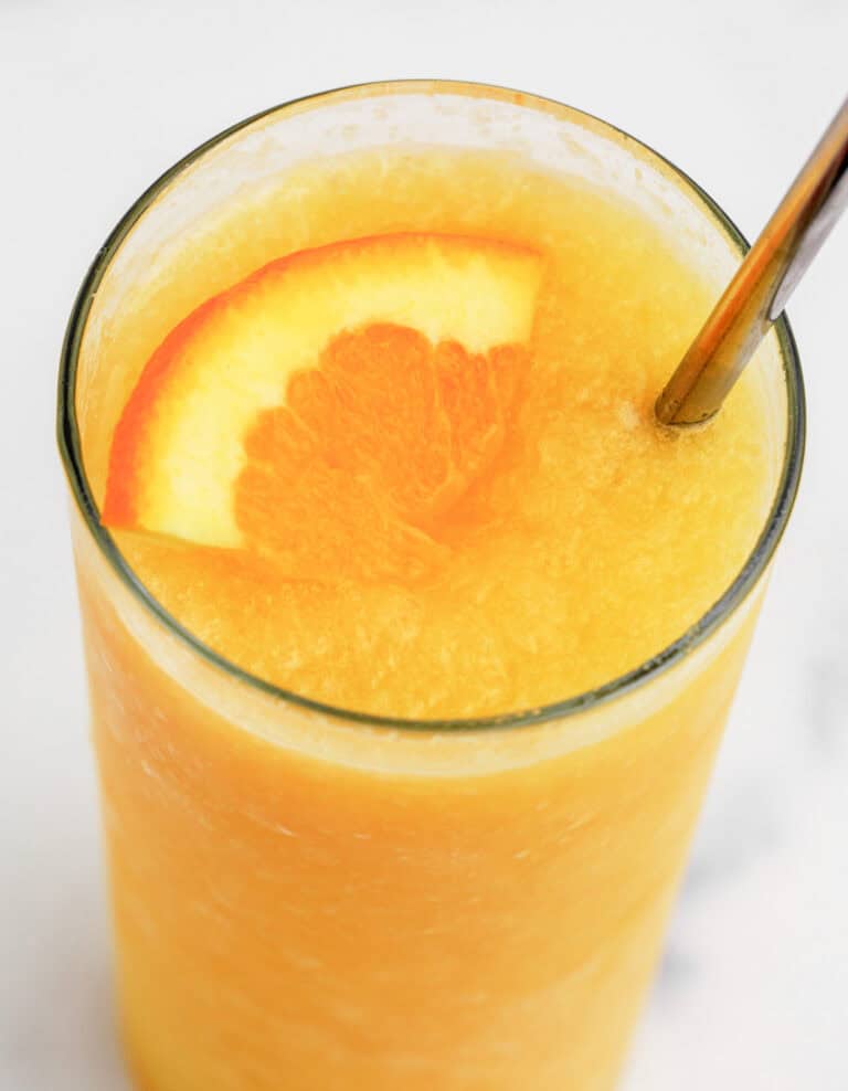 Sunrise Slush in Glass with Orange Wedge and Straw