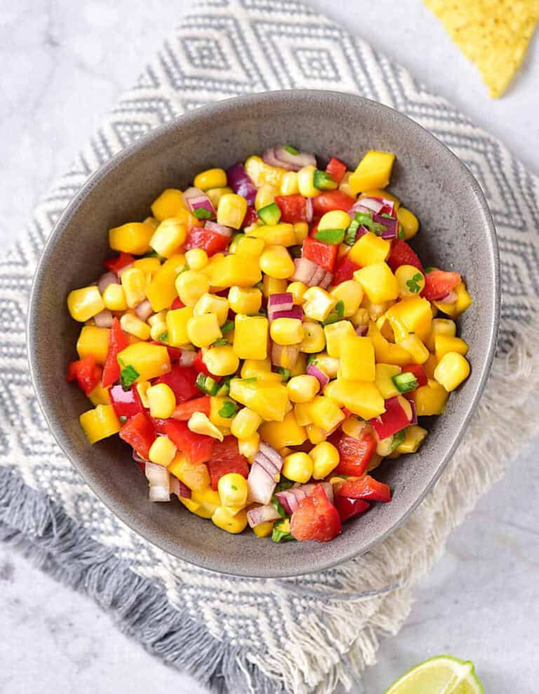 Mango Corn Salsa in Grey Bowl on Kitchen Towel