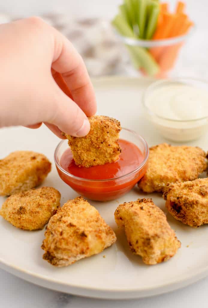 Dipping Chicken Nugget in Ketchup