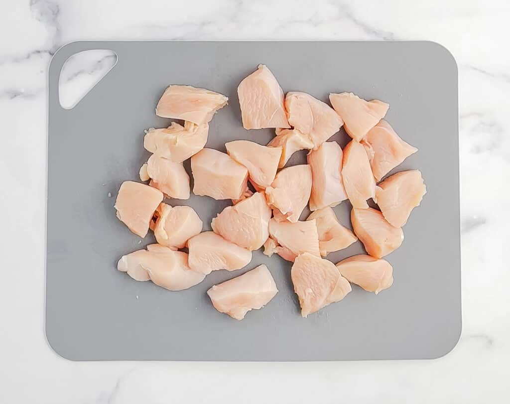 Chicken Breast in Pieces on Cutting Mat