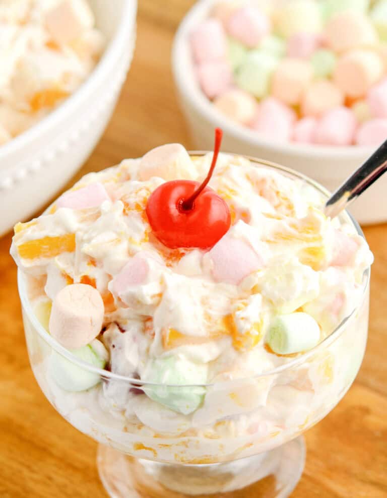 Ambrosia Salad in Bowl with Cherry and Spoon