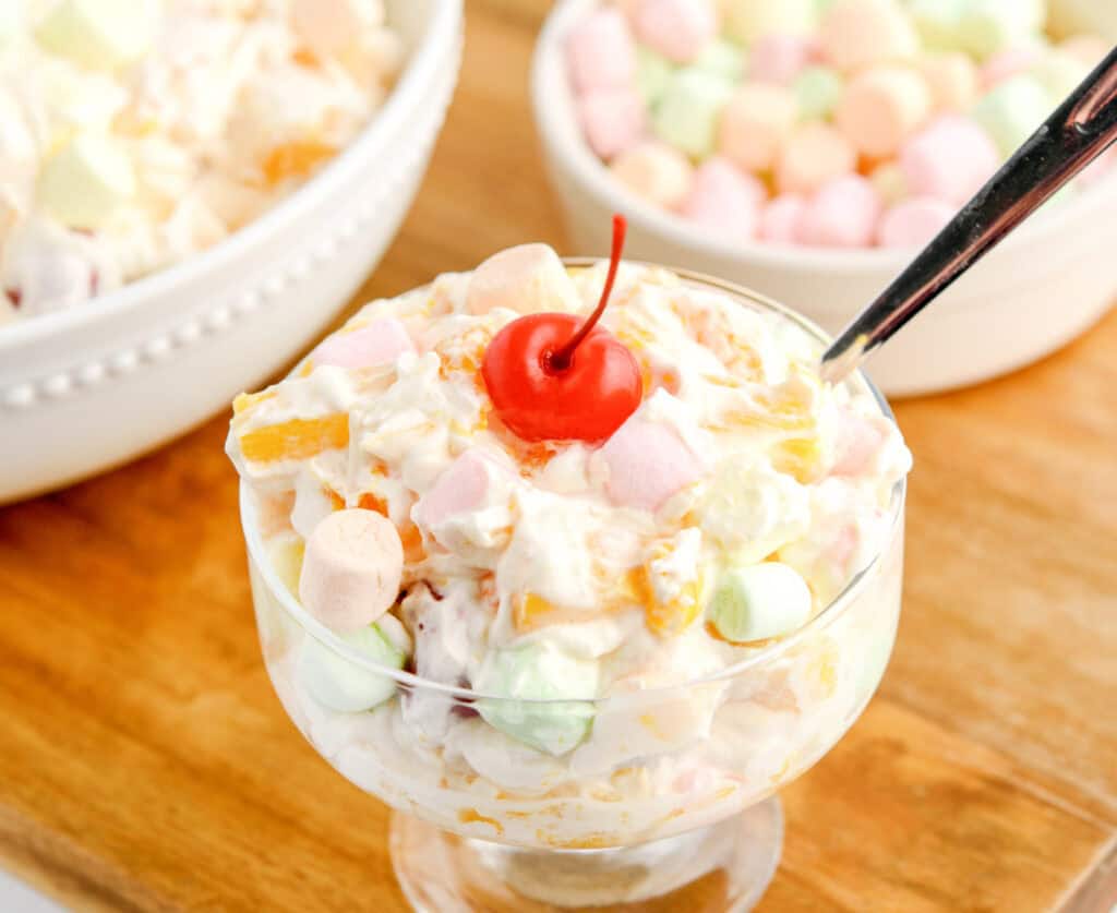 Ambrosia Salad in Dessert Bowl with Spoon and Cherry