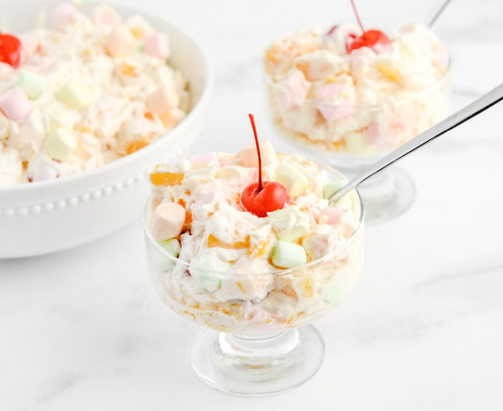 Ambrosia Salad in Dessert Bowl with Spoon and Cherry