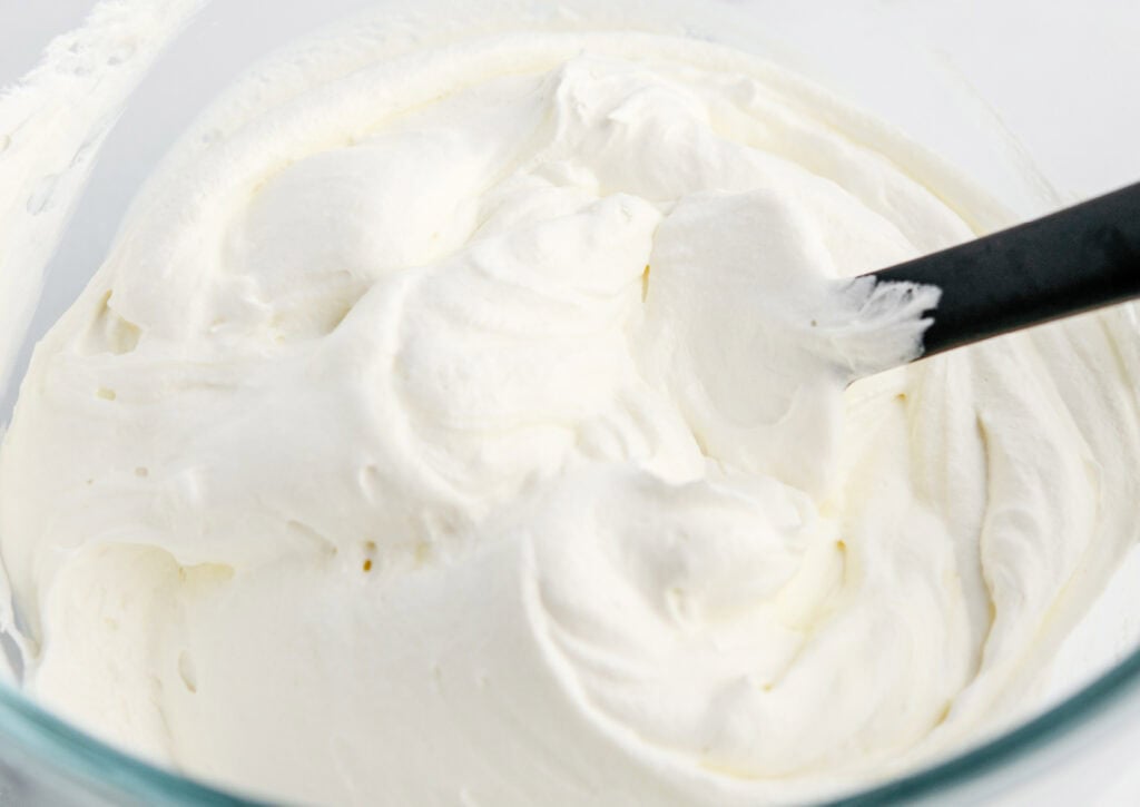 Mixing Cool Whip and Yogurt in Bowl