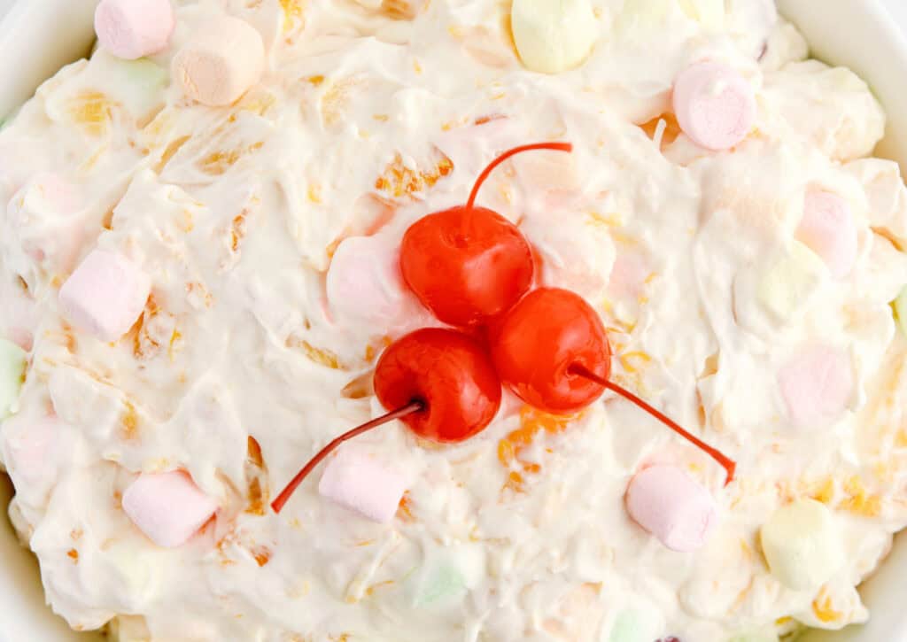Ambrosia Salad Garnished with Cherries and Marshmallows