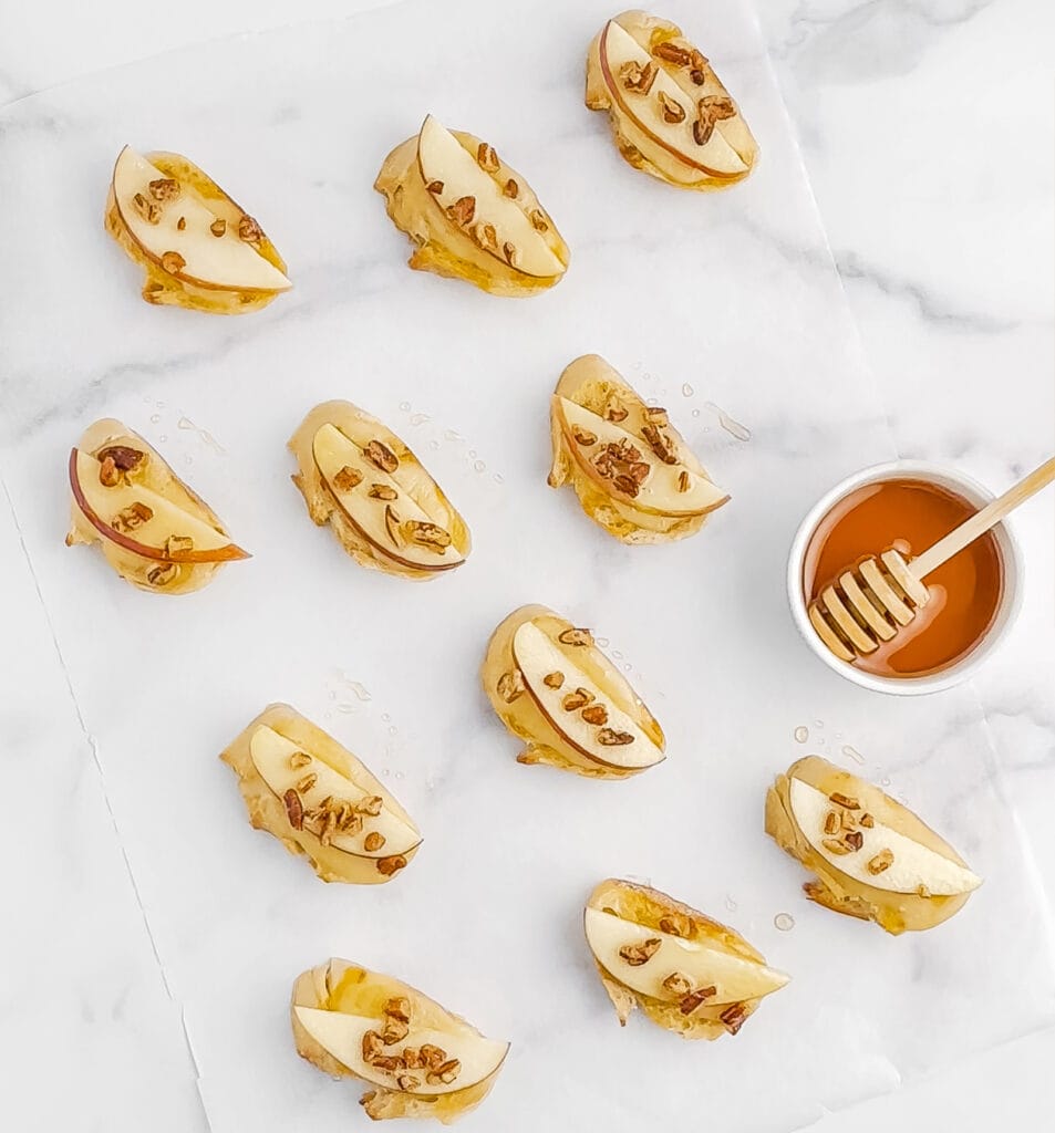 Drizzling Honey Over Apple Brie Crostini