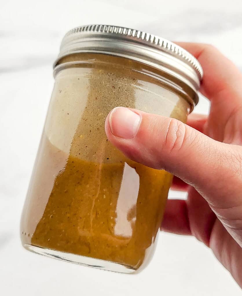 Shaking Mason Jar with Vinaigrette