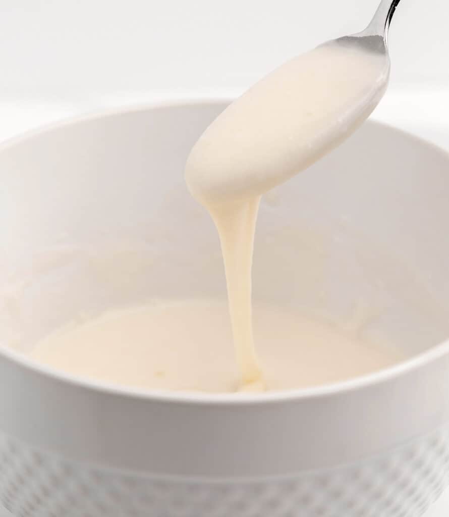 Frosting in a Bowl with Spoon