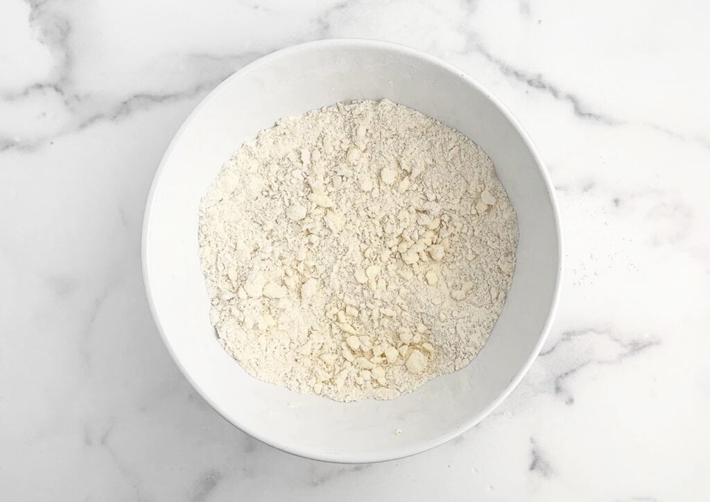 Butter Cut Into Dry Ingredients for Apple Pie Bar Crust