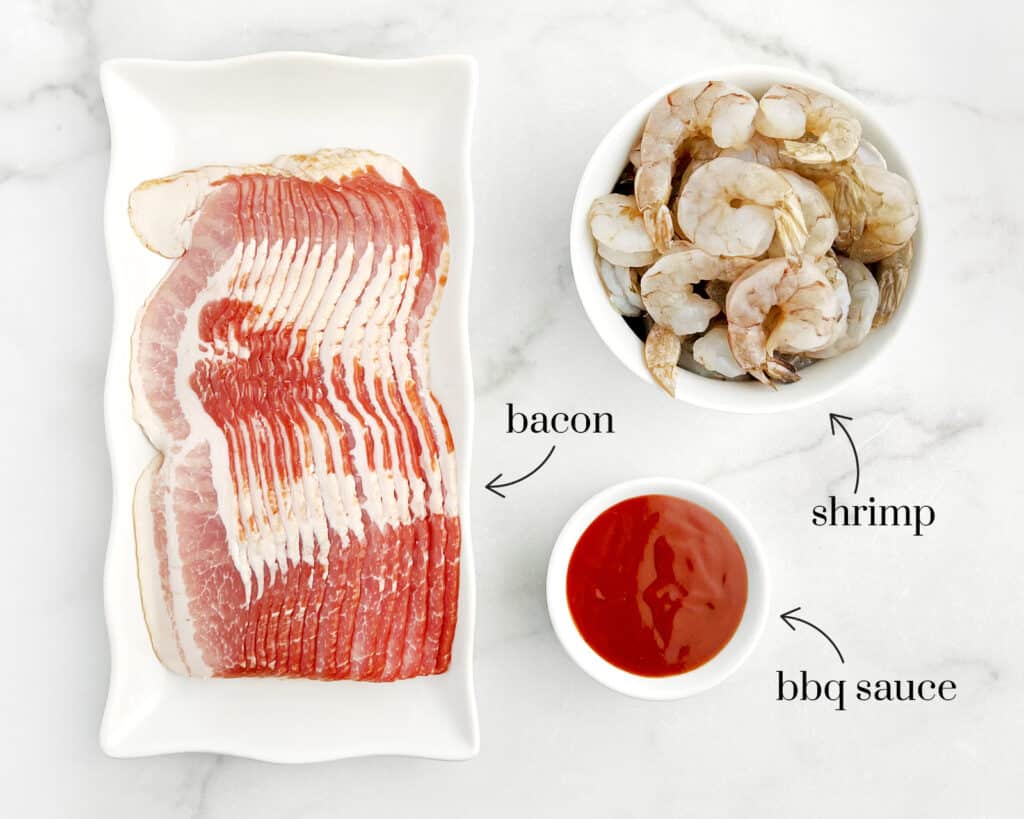 Raw Shrimp, Bacon, and Barbecue Sauce on White Surface