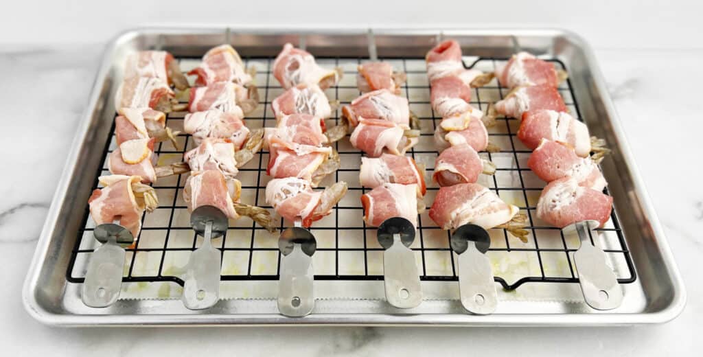 Prepared Bacon Wrapped Shrimp Kabobs on Baking Rack
