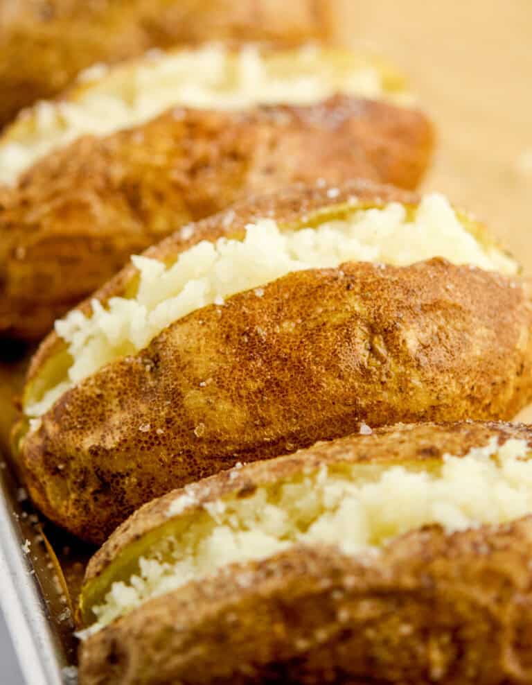 Baked Potatoes Cut Open and Mashed Inside