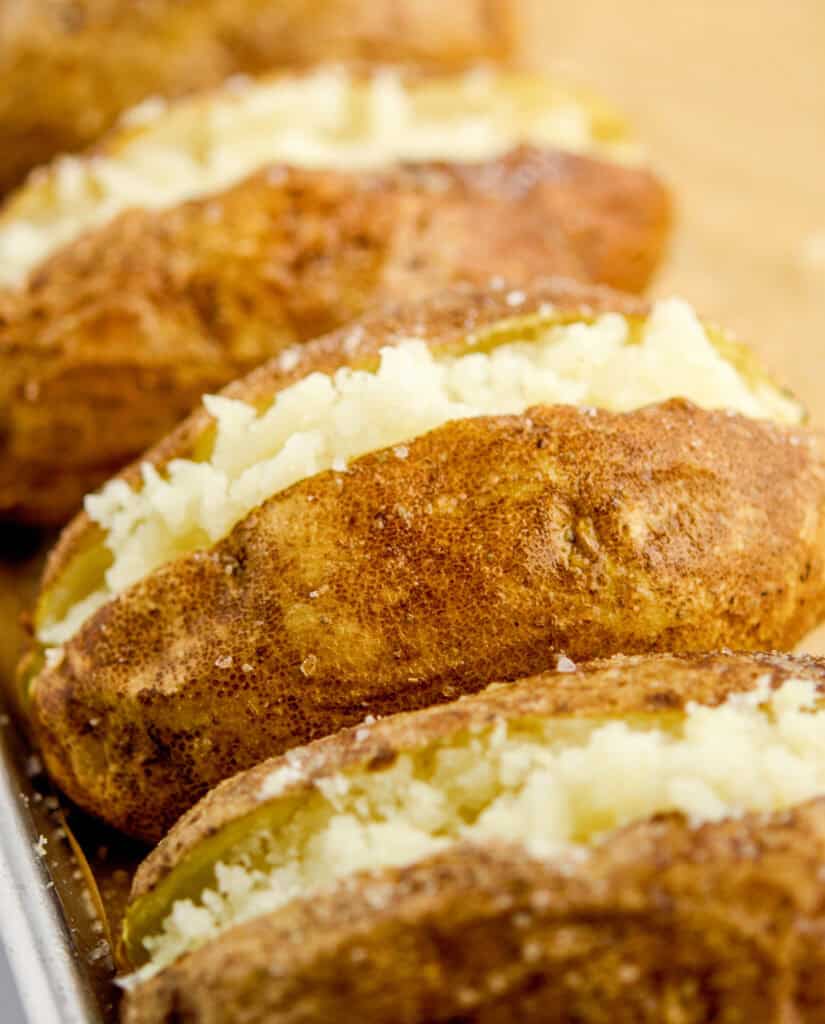 Cooked Potatoes Cut Open and Mashed on the Inside