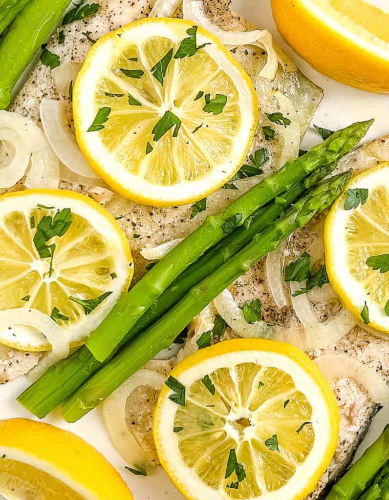 Baked Trout Fillet with Lemon, Herbs, and Asparagus