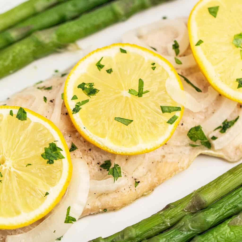 Trout Fillet Garnished and Plated with Asparagus
