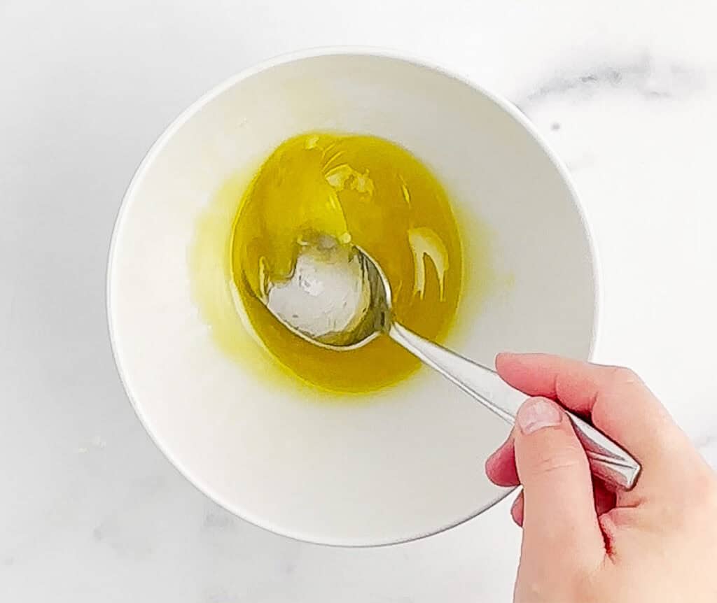 Mixing Lime Dressing in White Bowl