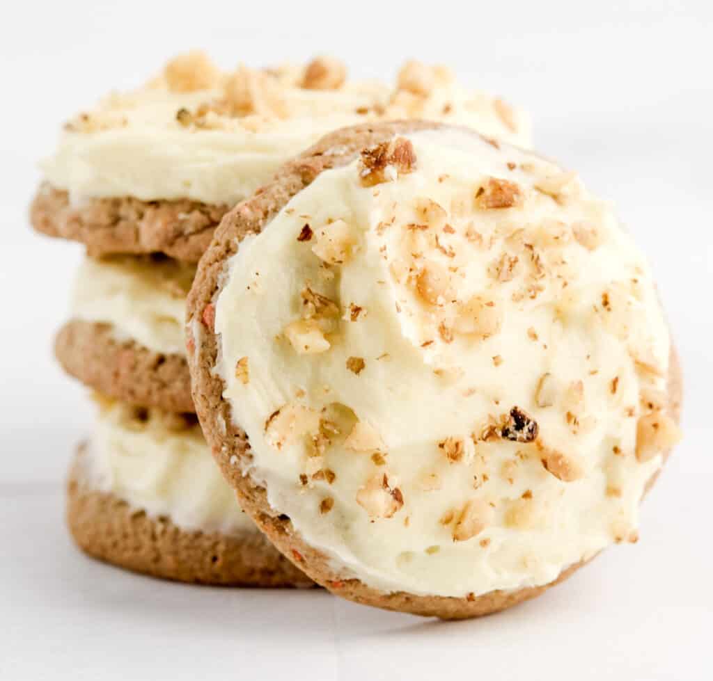 Stacked Carrot Cake Cookies with One Cookie on It's Side
