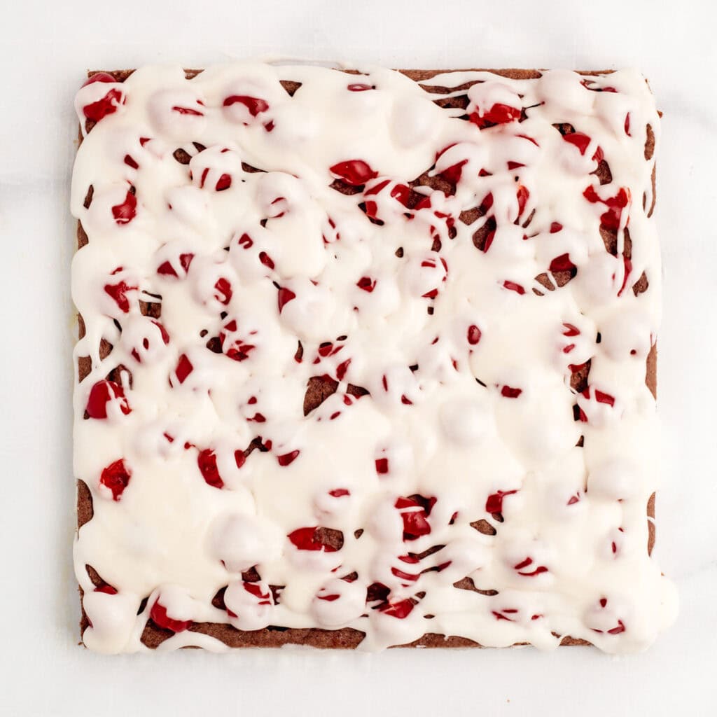 Frosting Drizzled Over Cherries and Crust