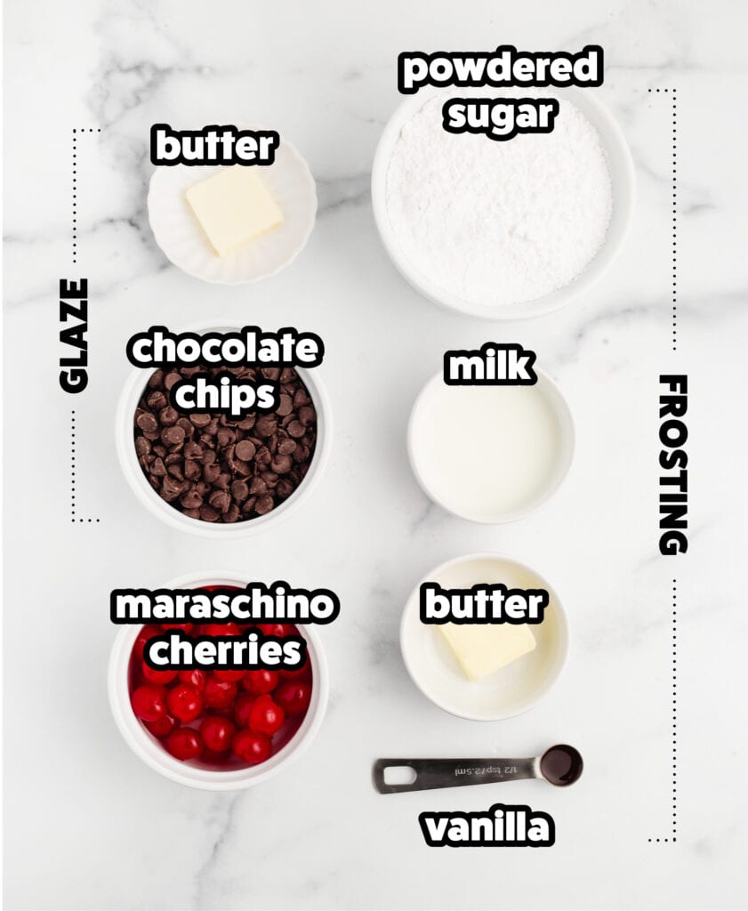 Frosting and Glaze Ingredients in Bowls on White Marble Surface