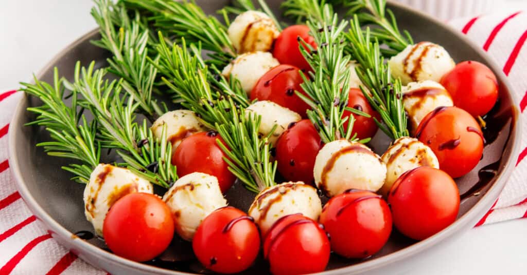Christmas Caprese Skewers on Plate with Red and White Striped Towel