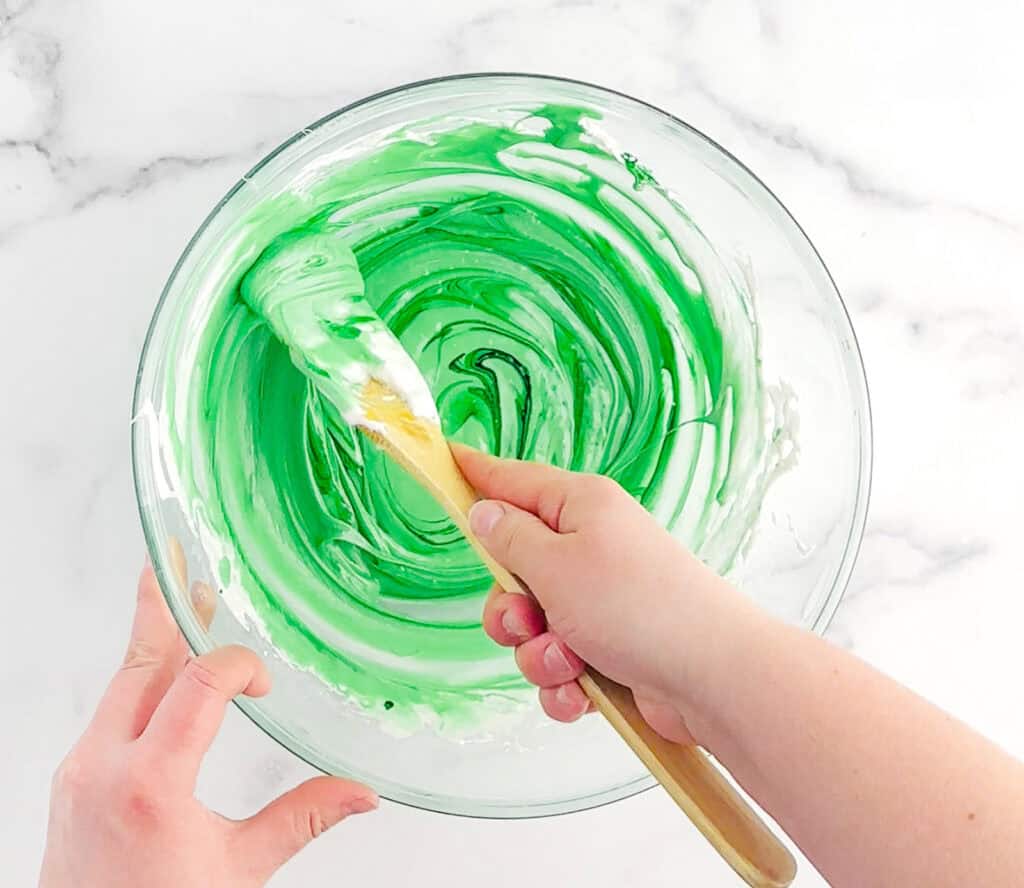 Stirring in Green Food Coloring to Melted Marshmallow Mixture