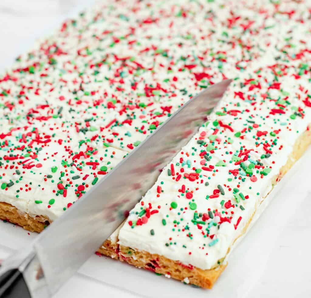 Cutting Frosted Sugar Cookie Bars with Knife