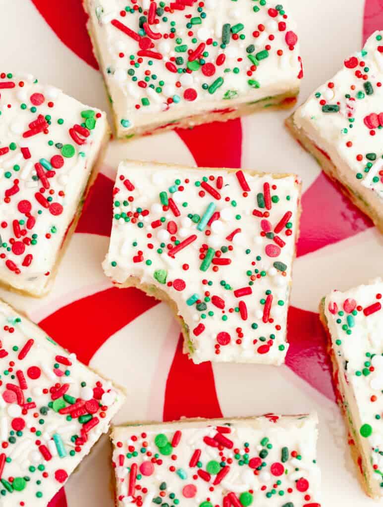 Frosted Sugar Cookie Bars on Red and White Platter