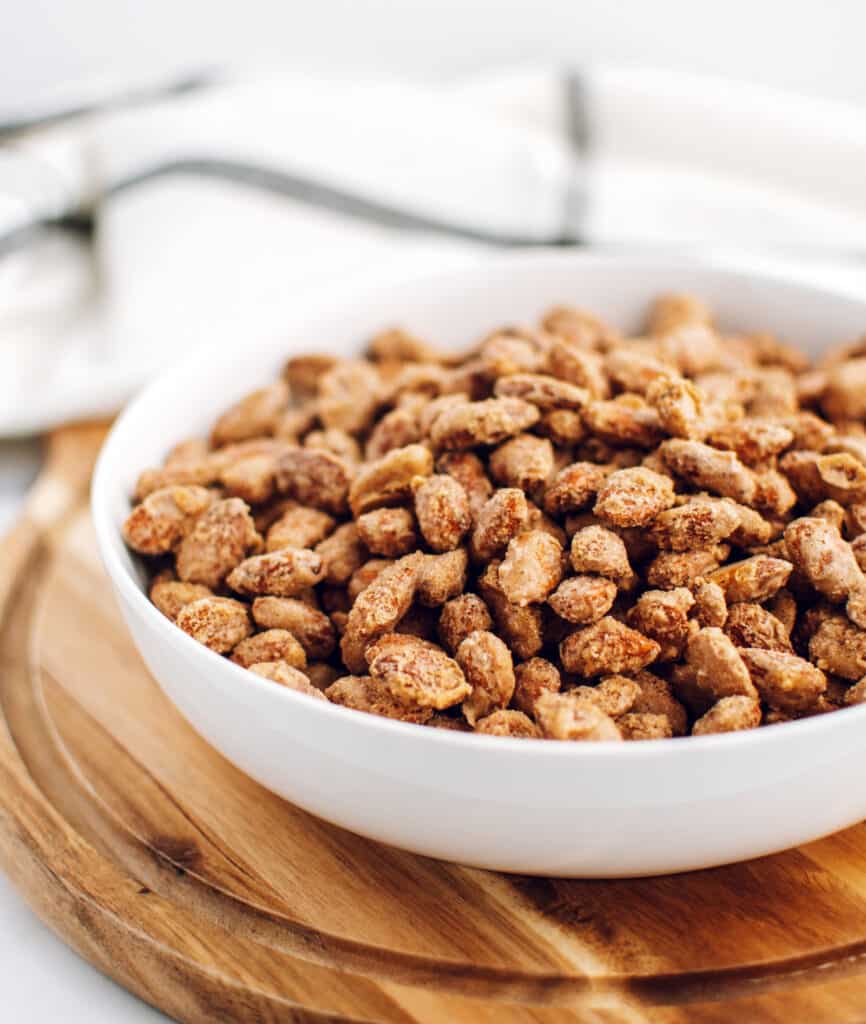 Bowl of Roasted Almonds on Wooden Cutting Board