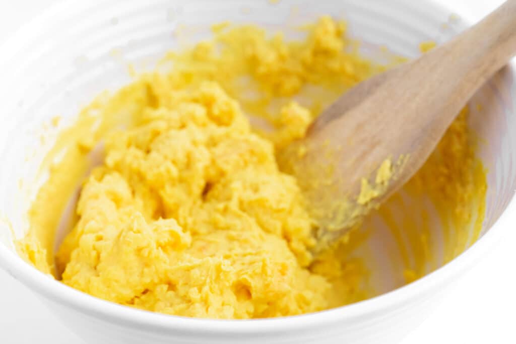 Deviled Egg Filling in a White Bowl with Spoon