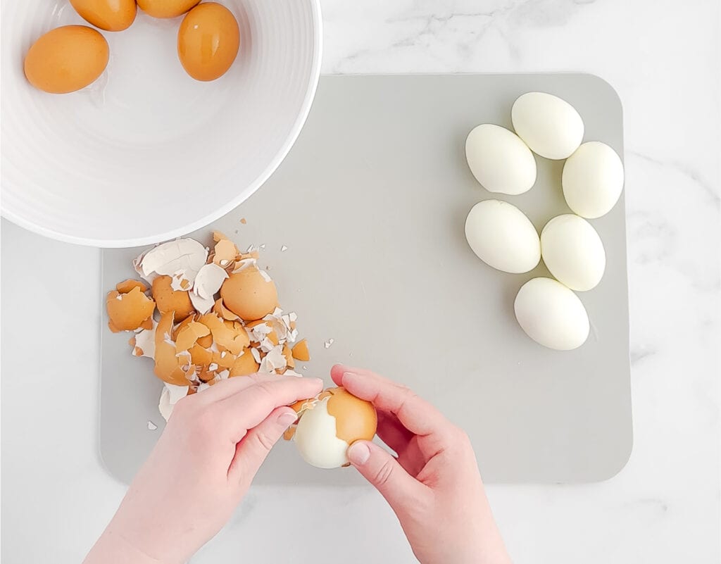 Peeling Eggs on Grey Cutting Board