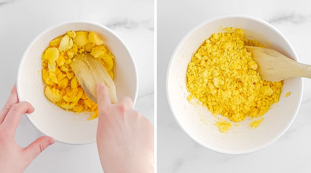 Egg Yolks in White Bowl with Wooden Spoon