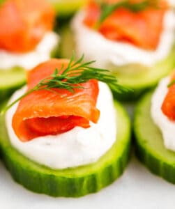 Cucumber Slices Topped with Seasoned Herb Filling, Salmon, and Herbs