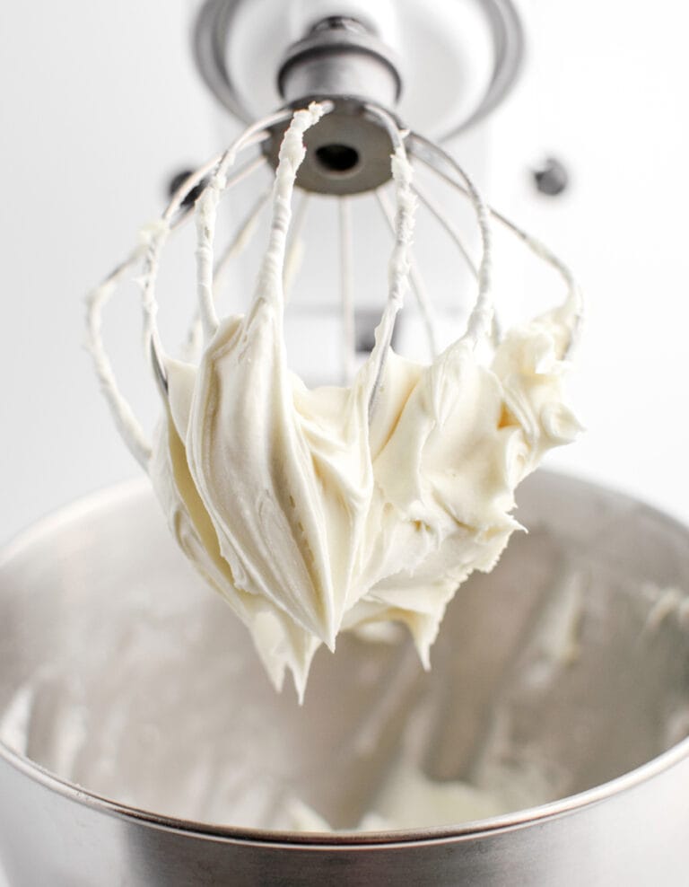 Easy Cream Cheese Frosting on Whisk of Stand Mixer