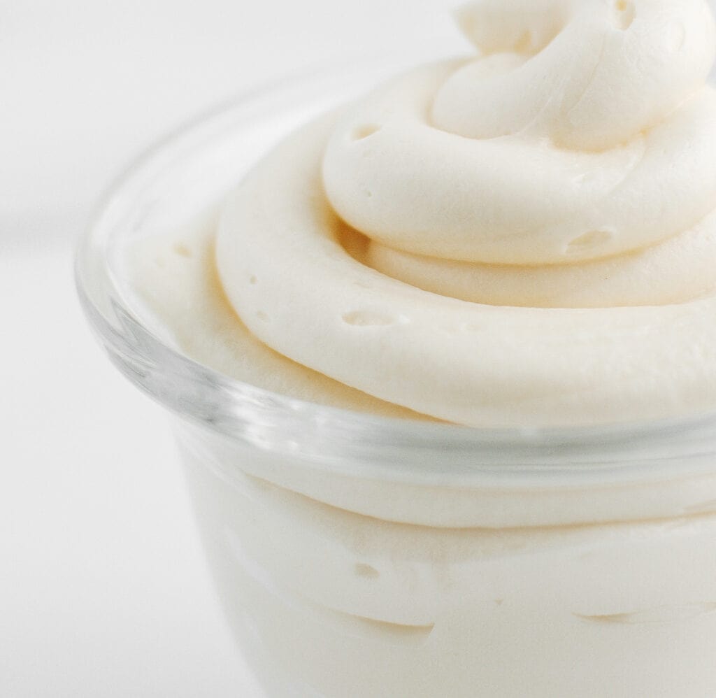 Closeup of Cream Cheese Frosting in Glass Cup