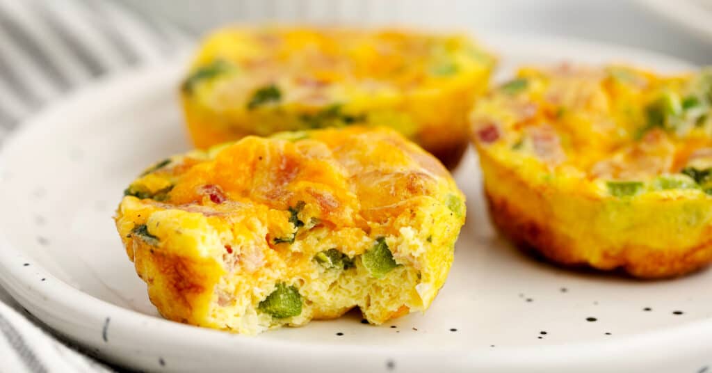 Closeup of Egg Bites on Plate with Kitchen Towel in Background