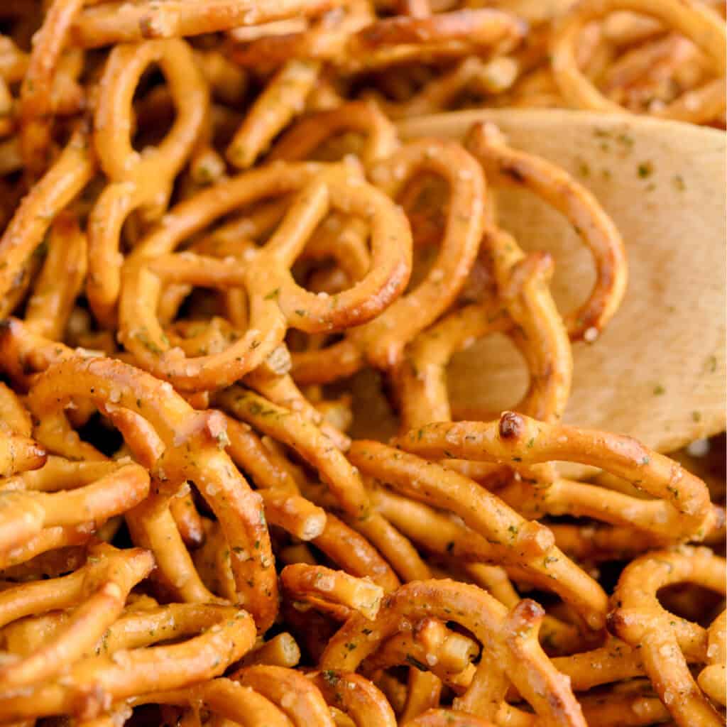 Closeup of Seasoned Pretzels with Wooden Spoon