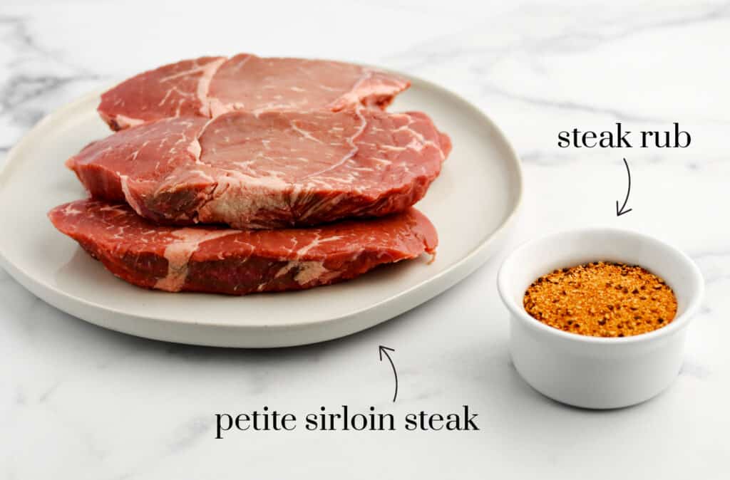 Sirloin Steak and Rub on White Marble Surface
