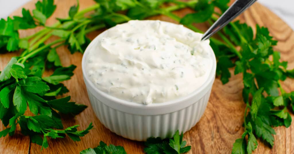 Green Goddess Dip on Wooden Surface with Parsley