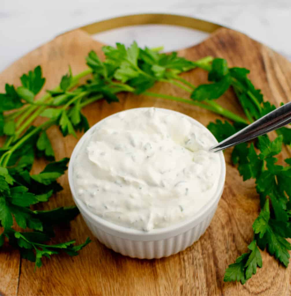 Green Goddess Dip with Parsley on Wooden Cutting Board