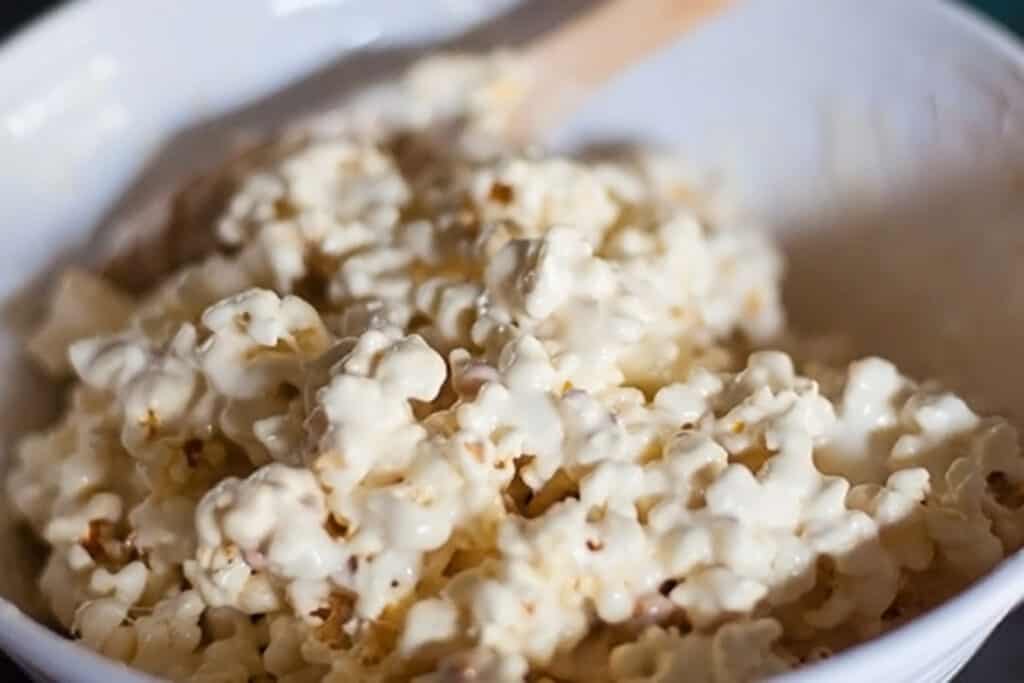 Melted Marshmallows with Popcorn in Bowl with Spoon