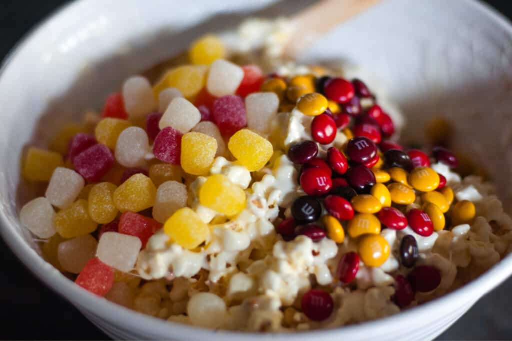 Marshmallow Covered Popcorn in Bowl with Gum Drops and M&Ms