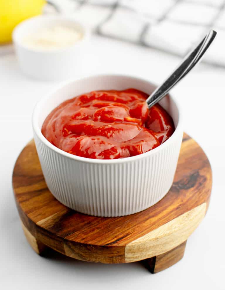 Cocktail Sauce in Bowl with Spoon on Wooden Riser