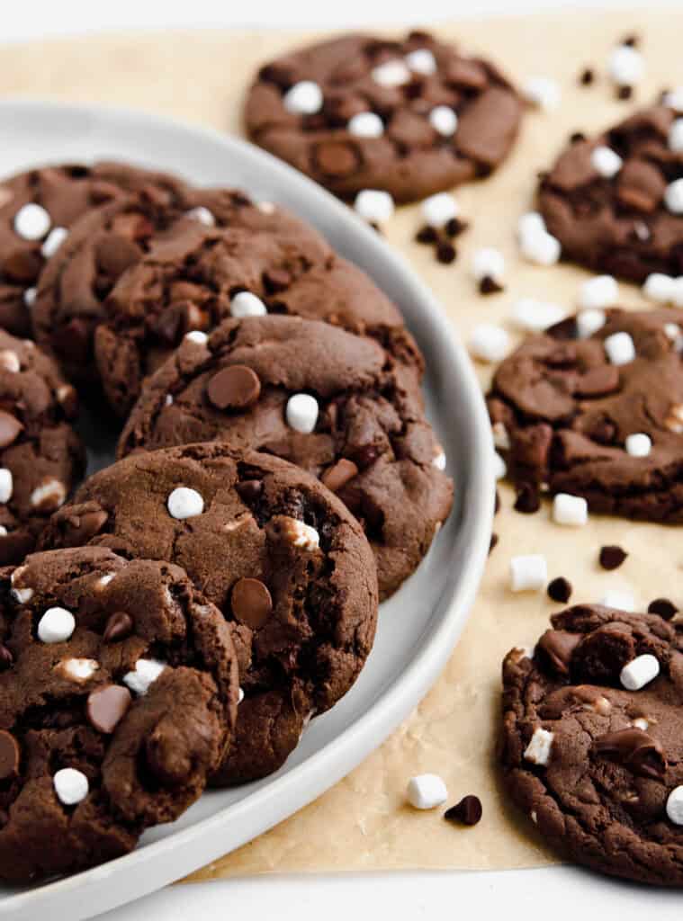Hot Cocoa Cookies on Platter with Marshmallows and Chocolate Chips Around It