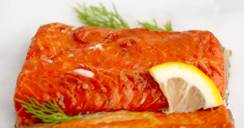Hot Smoked Salmon with Herb and Lemon on White Surface