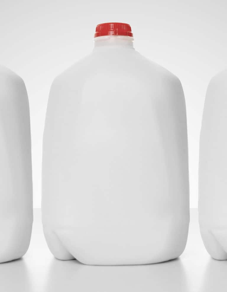 Gallon Jugs of Milk with Red Lids