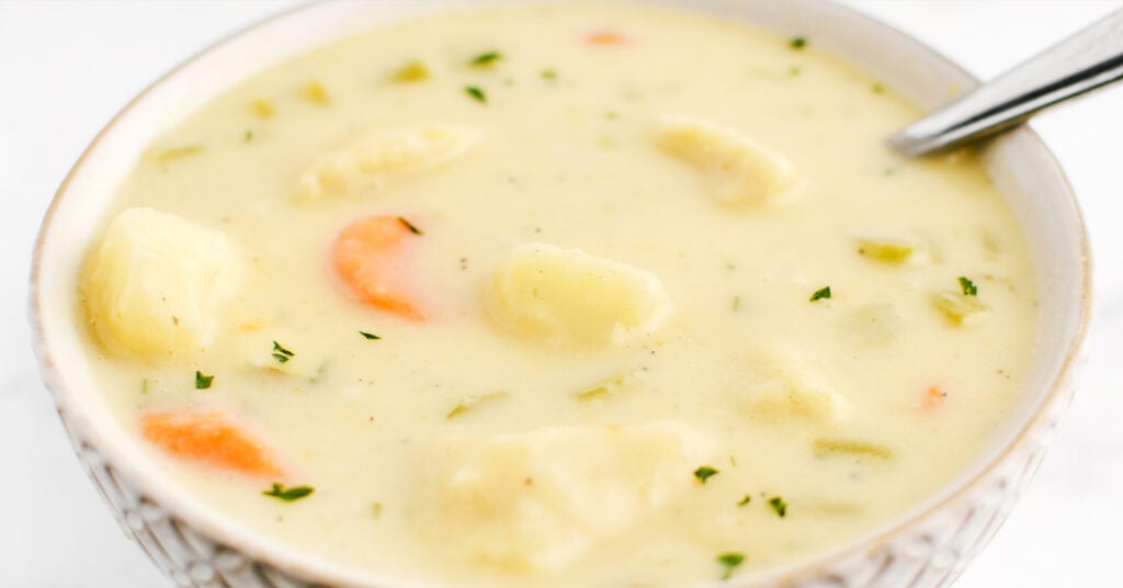 Knoephla Soup in White Bowl with Spoon