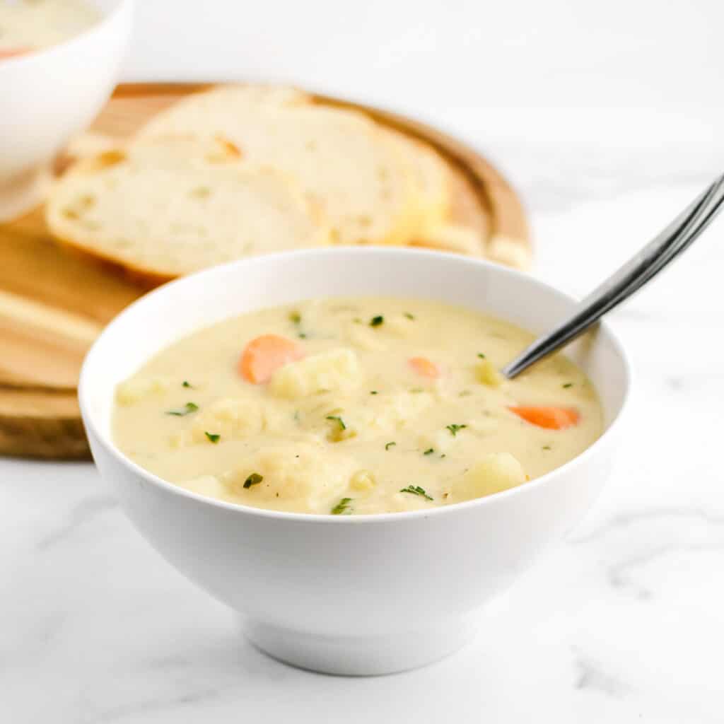 Knoephla Soup with Bread Slices Behind