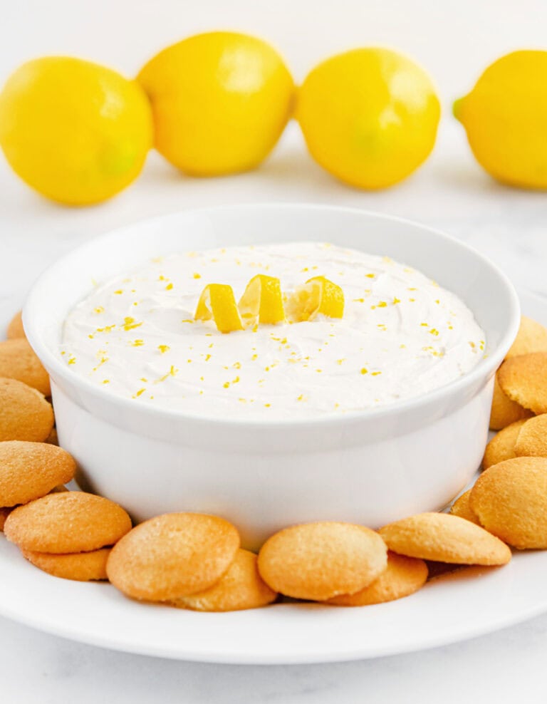 Lemon Cheesecake Dip in Bowl with Nilla Wafers Around it on a Plate