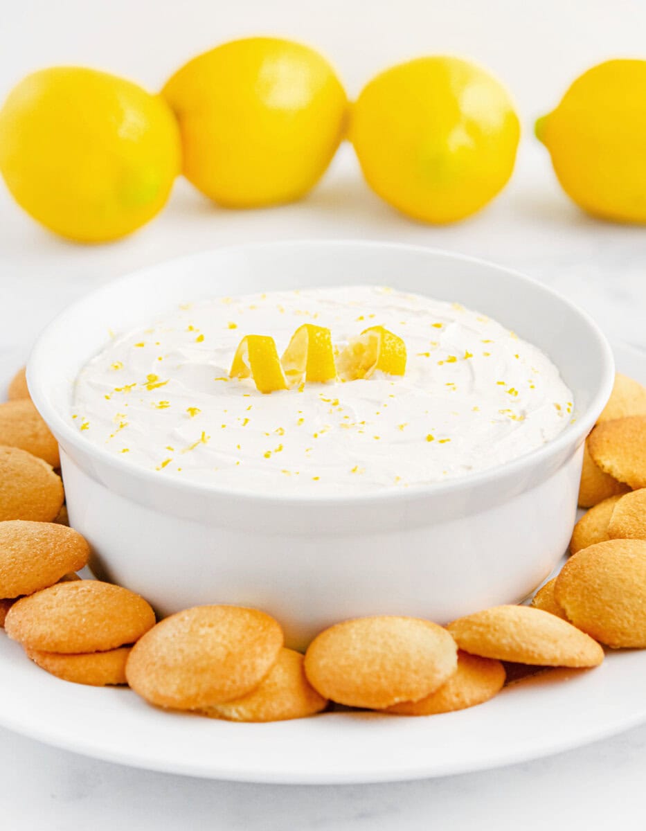 Lemon Cheesecake Dip in Bowl with Nilla Wafers Around it on a Plate